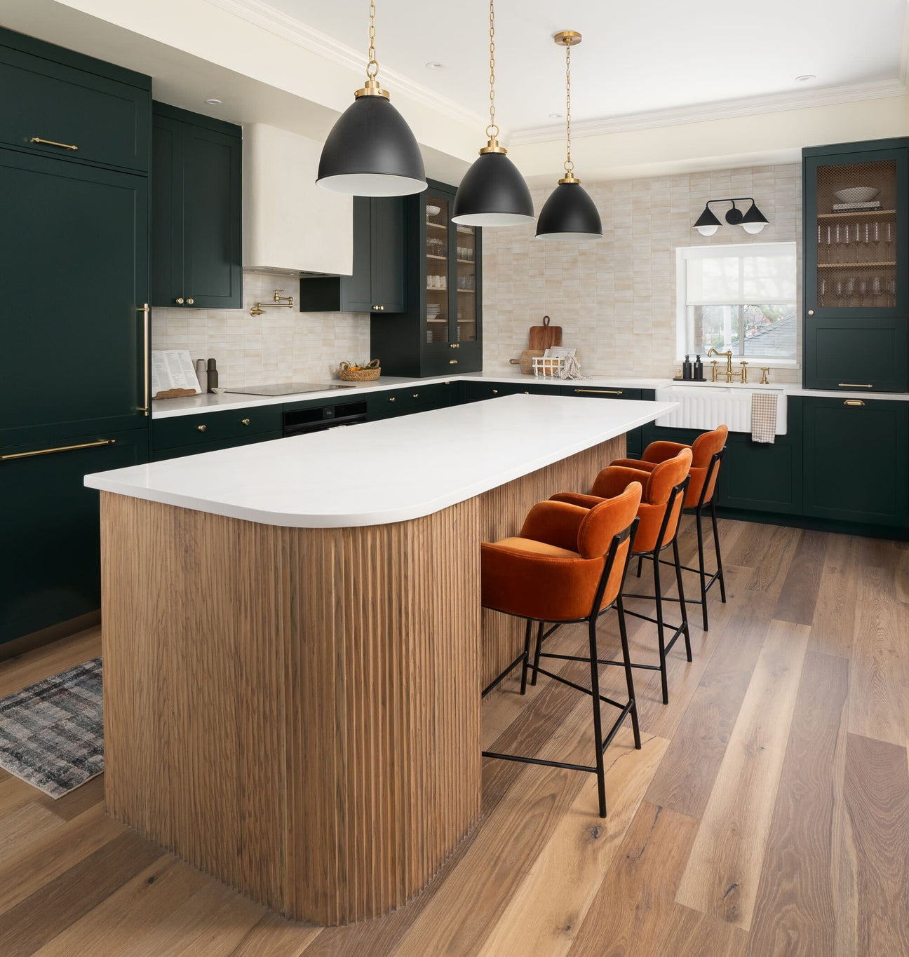 Modern kitchen with a island and orange chairs